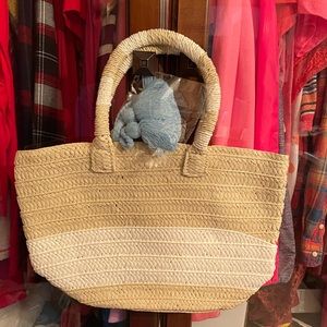 Brand new in package Altru Made for Good straw type bag with blue pom.